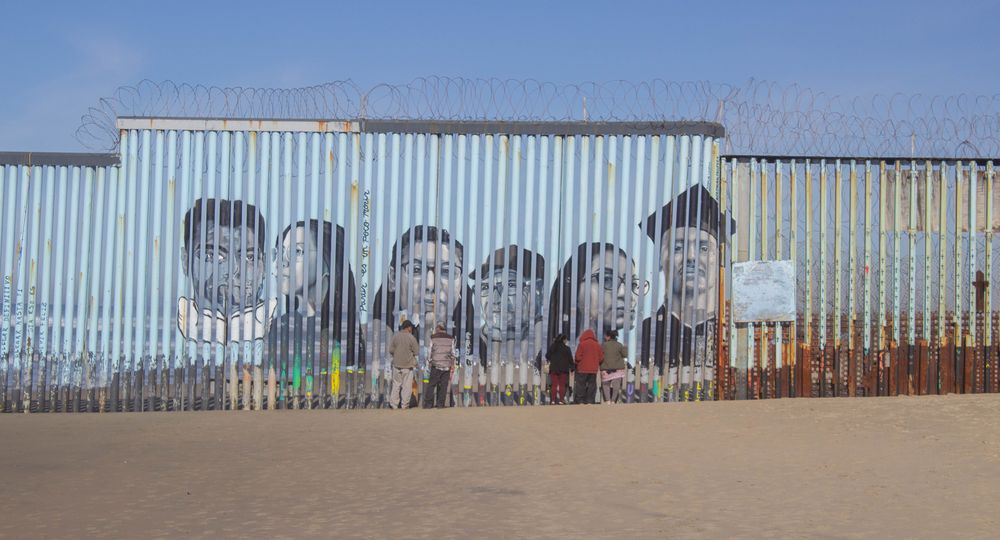 Tijuana Baja California, Mexico - January 18, 2020. People talking with their family between the border that divides the United States and Mexico between San Diego and Tijuana