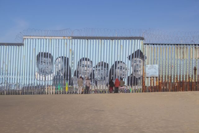 Tijuana Baja California, Mexico - January 18, 2020. People talking with their family between the border that divides the United States and Mexico between San Diego and Tijuana