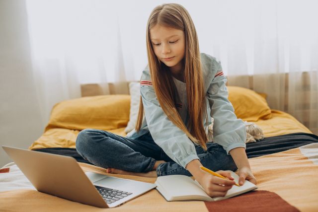 school-girl-studying-home-distant-learning