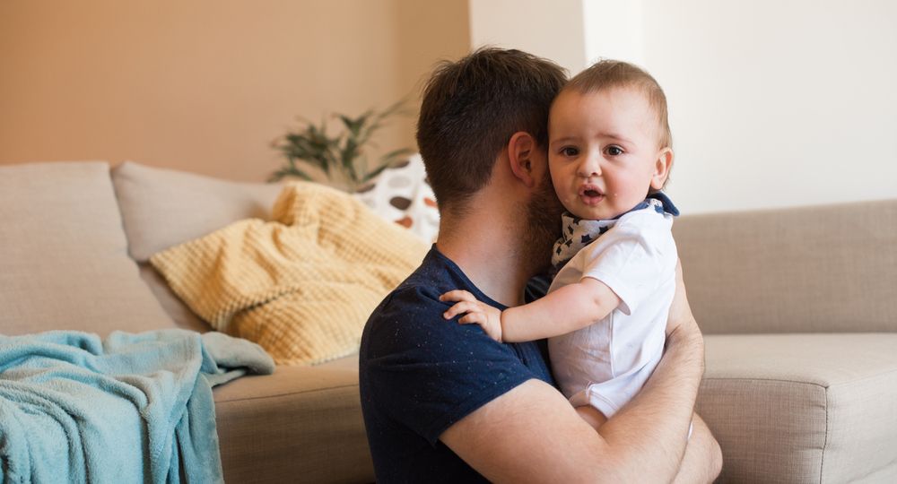 Father comforting crying baby