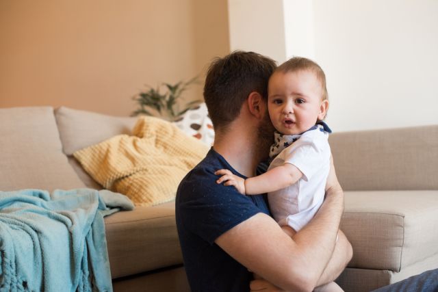 Father comforting crying baby