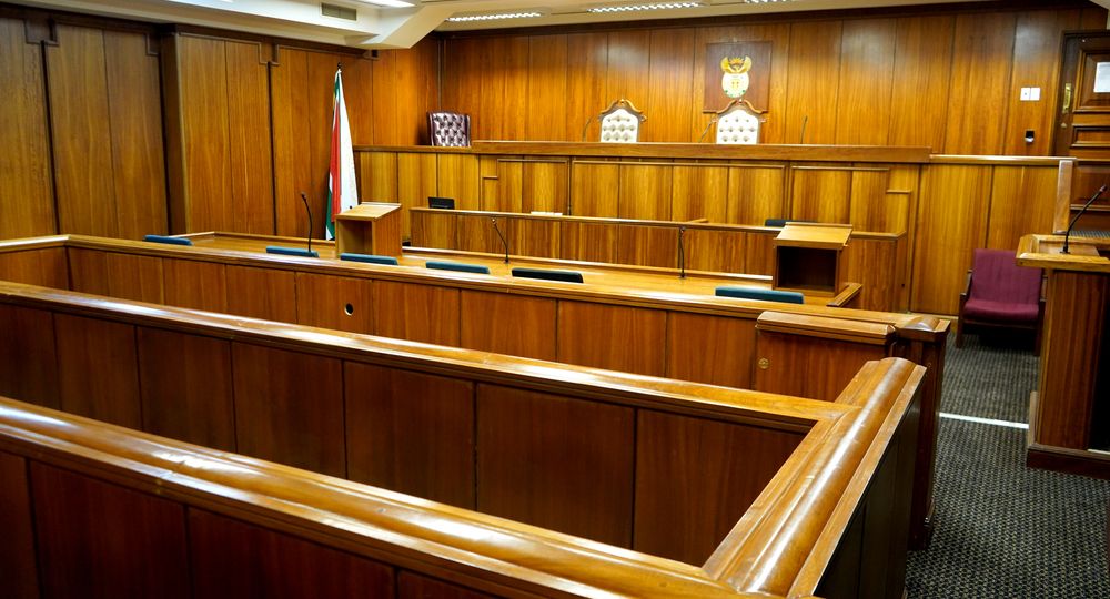 Interior of a courtroom, wood paneled