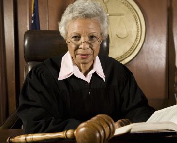 Female judge sitting in court, portrait