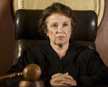 Senior female Caucasian judge sitting in the courtroom