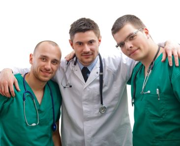Portrait of a young male doctor with his medical team